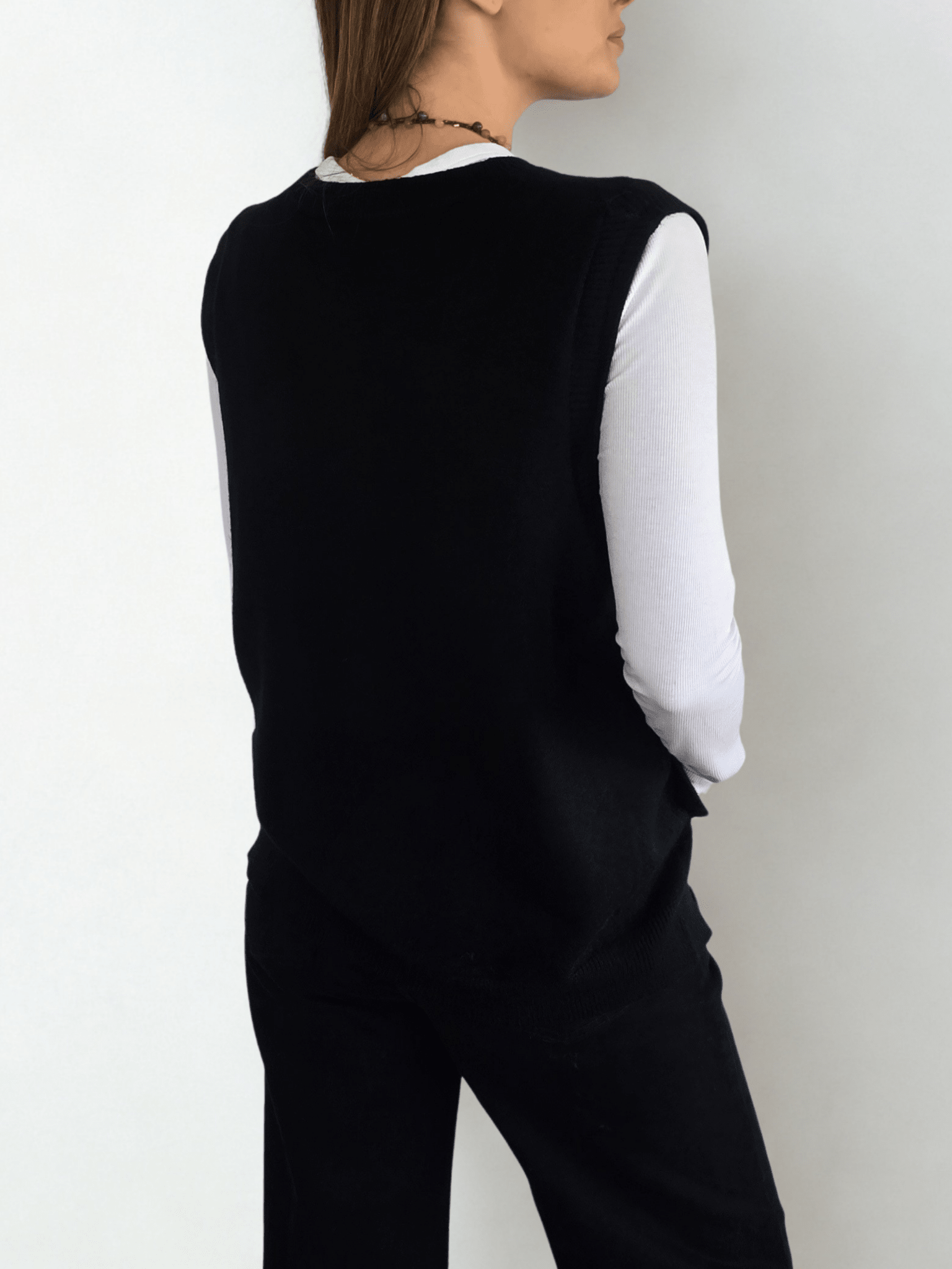 Sweater sin mangas Botones, color Negro